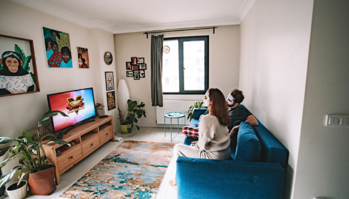 people watching tv with facemasks on